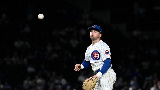 Sep 20, 2023; Chicago, Illinois, USA; Chicago Cubs second baseman Nico Hoerner (2) throws out Pittsburgh Pirates right fielder Joshua Palacios (54) a first base during the ninth inning at Wrigley Field. Mandatory Credit: Matt Marton-USA TODAY Sports