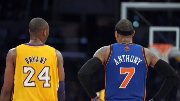 Dec 29, 2011; Los Angeles, CA, USA; Los Angeles Lakers guard Kobe Bryant (24) and New York Knicks forward Carmelo Anthony (7) during the game at the Staples Center. The Lakers defeated the Knicks 99-82.