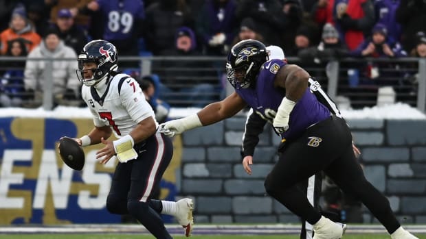 Jan 20, 2024; Baltimore, MD, USA; Houston Texans quarterback C.J. Stroud (7) pulls away from Baltimore Ravens defensive tackle Justin Madubuike (92) during the first quarter of a 2024 AFC divisional round game at M&T Bank Stadium. Mandatory Credit: Tommy Gilligan-USA TODAY Sports