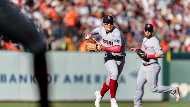 Jul 29, 2023; San Francisco, California, USA; Boston Red Sox shortstop Yu Chang (20) throws to first base for an out against the San Francisco Giants during the seventh inning at Oracle Park.
