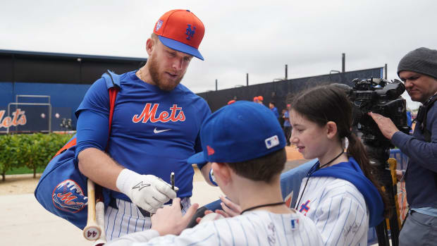 Feb 19, 2024; Port St. Lucie, FL, USA; New York Mets outfielder Harrison Bader (44) signs autographs in between workouts at spring training. Mandatory Credit: Jim Rassol-USA TODAY Sports