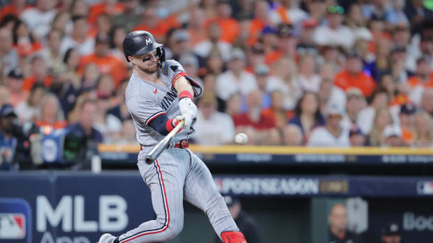 Oct 7, 2023; Houston, Texas, USA; Minnesota Twins catcher Ryan Jeffers (27) hits a single in the second inning against the Houston Astros during game one of the ALDS for the 2023 MLB playoffs at Minute Maid Park.