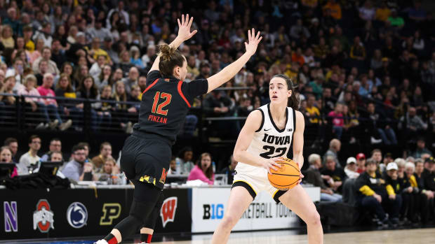 Mar 4, 2023; Minneapolis, MINN, USA; Iowa Hawkeyes guard Caitlin Clark (22) looks to pass while Maryland Terrapins guard Elisa Pinzan (12) defends during the first half at Target Center.