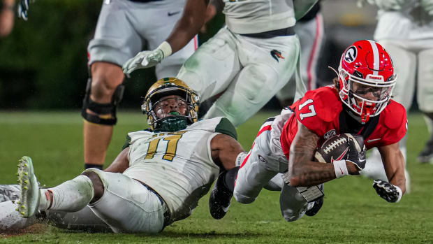 Sep 23, 2023; Athens, Georgia, USA; Georgia Bulldogs wide receiver Anthony Evans III (17) is tackled by UAB Blazers safety Damien Miller (11) during the second half at Sanford Stadium. (Dale Zanine / USA TODAY Sports).