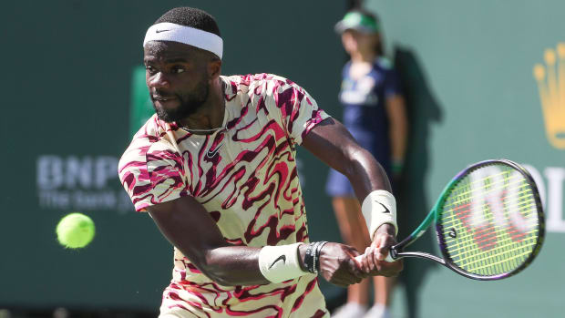 Francis Tiafoe hits a shot during his match against Daniil Medvedev at the BNP Paribas Open.