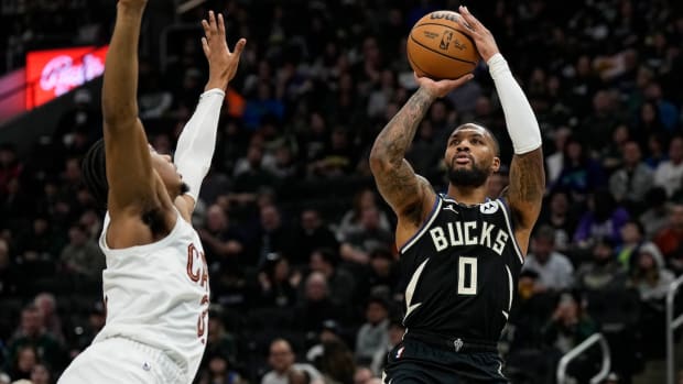 Milwaukee Bucks guard Damian Lillard (0) shoots during the first quarter against the Cleveland Cavaliers at Fiserv Forum in Milwaukee, Wisconsin, on Jan. 26, 2024.