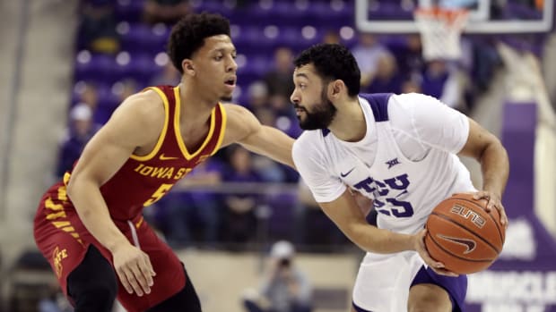 TCU Horned Frogs guard Alex Robinson (25) dribbles as Iowa State Cyclones guard Lindell Wigginton (5) defends during the first half at Ed and Rae Schollmaier Arena.