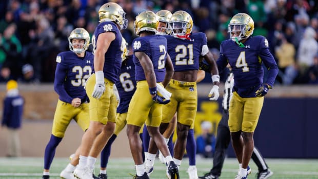 Notre Dame defensive players celebrate a play against Wake Forest.