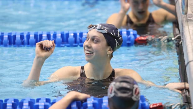 Gretchen Walsh celebrates after winning the ACC title and breaking her own ACC record in the 50-yard freestyle at the 2024 ACC Swimming & Diving Championships on Wednesday at the Greensboro Aquatic Center.