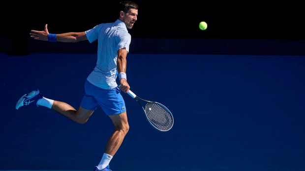 Novak Djokovic returns a shot.