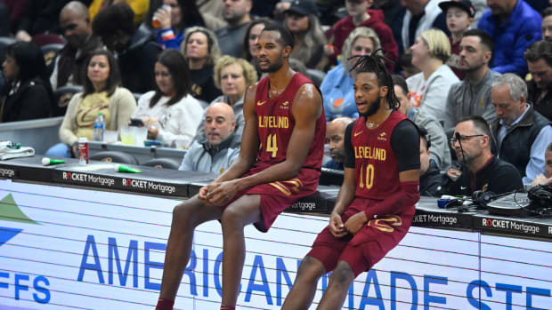 Nov 30, 2023; Cleveland, Ohio, USA; Cleveland Cavaliers forward Evan Mobley (4) and guard Darius Garland (10) wait to enter the game in the first quarter against the Portland Trail Blazers at Rocket Mortgage FieldHouse.
