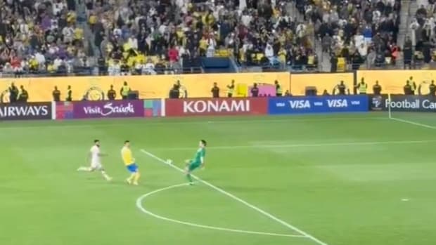 Cristiano Ronaldo pictured (center) moments before he punished an error by goalkeeper Vladimir Stojkovic (right) to score for Al Nassr in a 2-0 win over Al Feiha in the AFC Champions League in February 2024