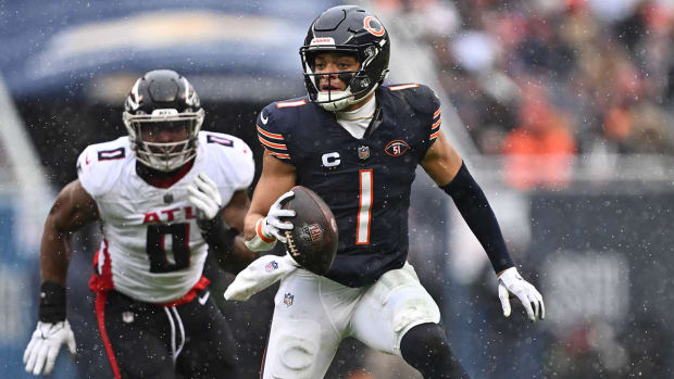 Bears quarterback Justin Fields scrambles during a game against the Falcons on Dec. 31, 2023.