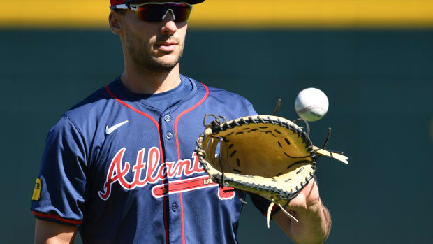 Atlanta Braves infielder Matt Olson (#28) warms up at the start of practice Tuesday, Feb. 20, 2024 at CoolToday Park in North Port, Florida.  