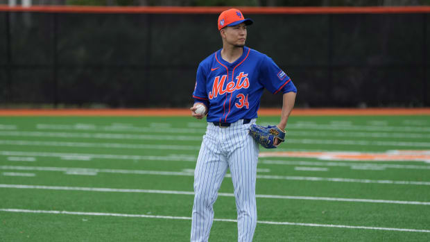 Feb 19, 2024; Port St. Lucie, FL, USA; New York Mets starting pitcher Kodai Senga (34) warms-up during workouts at spring training.