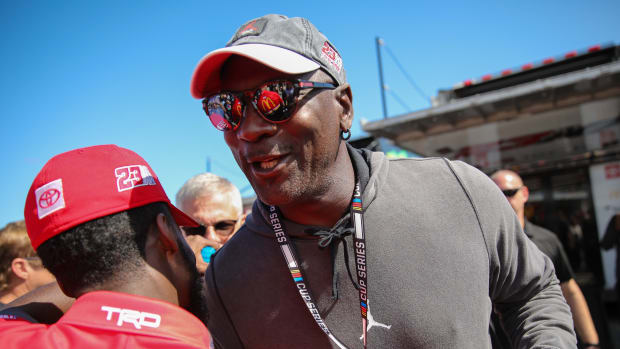 Michael Jordan greets crew members of NASCAR Cup Series driver Bubba Wallace (23) at Daytona International Speedway.