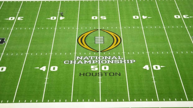 The 2024 CFP logo on the field before the 2024 College Football Playoff national championship game between the Michigan Wolverines and the Washington Huskies at NRG Stadium.