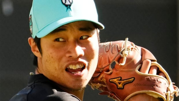Yu Min Lin pitches at Salt River Fields Spring Training 2024