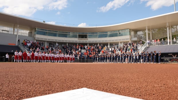 The national anthem is played at Palmer Park before the Virginia softball game against Louisville.