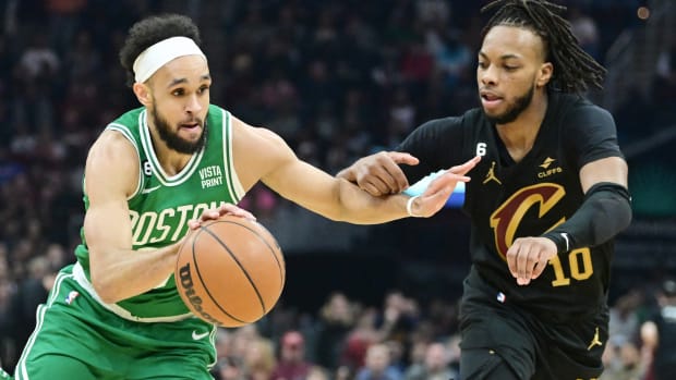 Mar 6, 2023; Cleveland, Ohio, USA; Boston Celtics guard Derrick White (9) drives to the basket against Cleveland Cavaliers guard Darius Garland (10) during the first half at Rocket Mortgage FieldHouse.