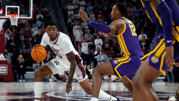 Feb 8, 2023; Starkville, Mississippi, USA; Mississippi State Bulldogs forward D.J. Jeffries (0) dribbles as LSU Tigers forward KJ Williams (12) defends during the first half at Humphrey Coliseum. Mandatory Credit: Petre Thomas-USA TODAY Sports