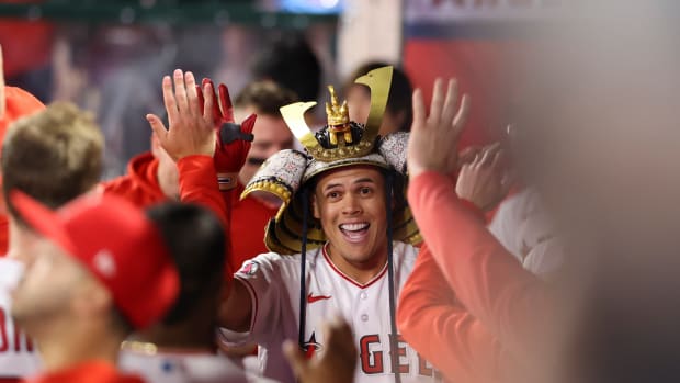 May 27, 2023; Anaheim, California, USA; Los Angeles Angels third baseman Gio Urshela (10) celebrates in the dugout with his teammates after hitting a home run to tie the game against the Miami Marlins during the eighth inning at Angel Stadium.