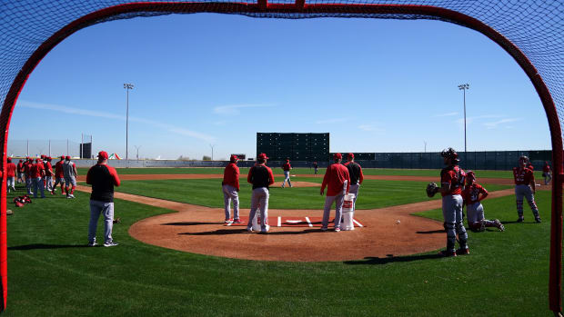 Cincinnati Reds coaches run fielding drills with pitchers and infielders during spring training workouts, Tuesday, Feb. 20, 2024, at the team s spring training facility in Goodyear, Ariz. 