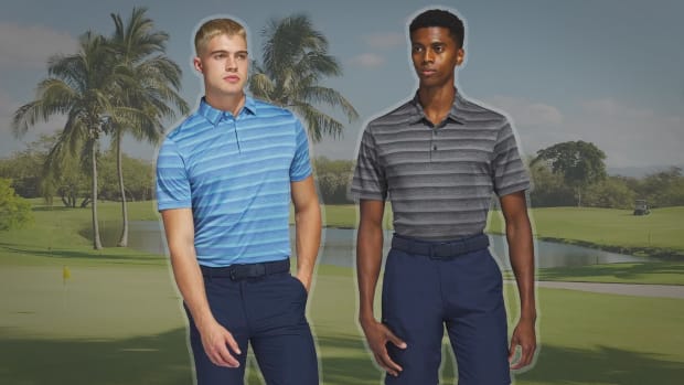 the adidas two color striped golf polo, seen here in blue and black, is on sale at pga tour superstore.