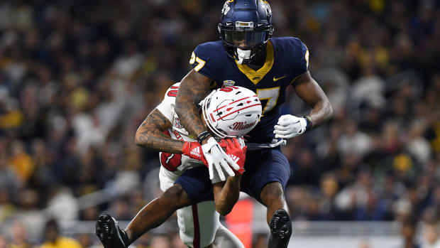 Dec 2, 2023; Detroit, MI, USA; Toledo Rockets cornerback Quinyon Mitchell (27) breaks up a pass intended for Miami (OH) Redhawks wide receiver Gage Larvadain (10) in the third quarter at Ford Field. Mandatory Credit: Lon Horwedel-USA TODAY Sports