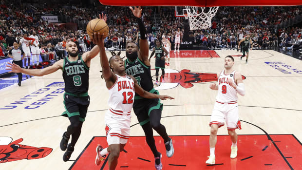  Chicago Bulls guard Ayo Dosunmu (12) goes to the basket against Boston Celtics guard Jaylen Brown (7) during the second half at United Center.