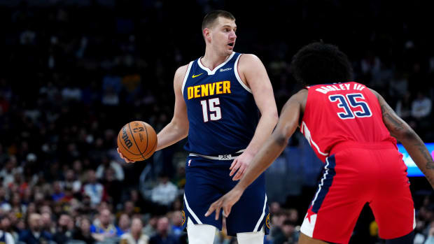 Feb 22, 2024; Denver, Colorado, USA; Denver Nuggets center Nikola Jokic (15) controls the ball in the first quarter against the Washington Wizards at Ball Arena. Mandatory Credit: Ron Chenoy-USA TODAY Sports