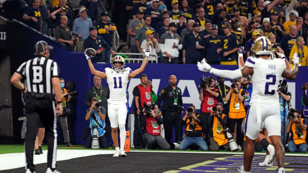 Jan 8, 202Jan 8, 2024; Houston, TX, USA; Washington Huskies wide receiver Jalen McMillan (11) celebrates after catching a touchdown during the second quarter against the Michigan Wolverines in the 2024 College Football Playoff national championship game at NRG Stadium. Mandatory Credit: Kirby Lee-USA TODAY Sports  4; Houston, TX, USA; Washington Huskies wide receiver Jalen McMillan (11) celebrates after catching a touchdown during the second quarter against the Michigan Wolverines in the 2024 College Football Playoff national championship game at NRG Stadium. Mandatory Credit: Kirby Lee-USA TODAY Sports  