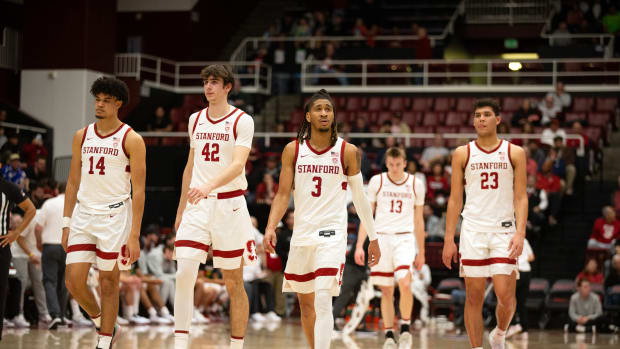 Feb 22, 2024; Stanford, California, USA; The Stanford Cardinal starting five forward Spencer Jones (14), forward Maxime Raynaud (42), guard Kanaan Carlyle (3), guard Michael Jones (13) and forward Brandon Angel (23) walk back onto the court follow a timeout during the first half against the Oregon Ducks at Maples Pavilion. Mandatory Credit: D. Ross Cameron-USA TODAY Sports