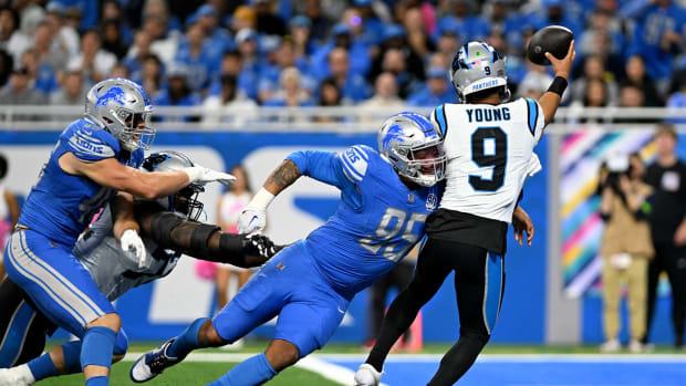Oct 8, 2023; Detroit, Michigan, USA; Detroit Lions defensive end Romeo Okwara (95) nearly sacks Carolina Panthers quarterback Bryce Young (9) in the end zone in the third quarter at Ford Field. Okwara forced Young into an intentional grounding penalty on the play.