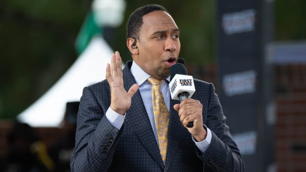 Caption: Sports commentator Stephen A. Smith speaks during a live taping of ESPN's \"First Take\" at Florida A&M University's new Will Packer Performing Arts Amphitheater as part of the school's homecoming festivities Friday, Oct. 29, 2021.