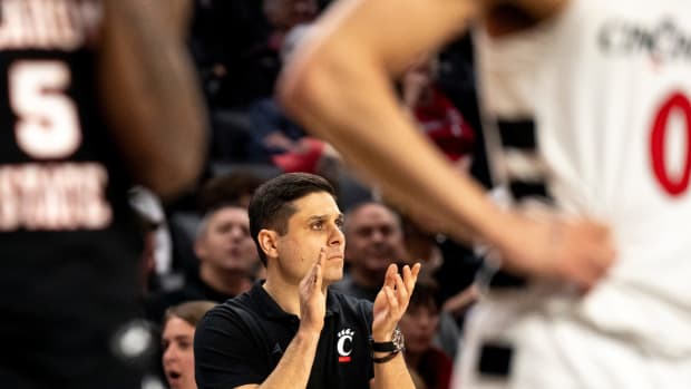 Cincinnati Bearcats head coach Wes Miller claps in the second half of the NCAA basketball game between Cincinnati Bearcats and Oklahoma State Cowboys at Fifth Third Arena in Cincinnati on Wednesday, Feb. 21, 2024.