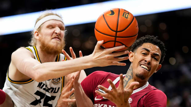 Missouri Tigers center Connor Vanover (75) and Arkansas Razorbacks forward Jalen Graham (11) fight for a rebound during the first half at Mizzou Arena.