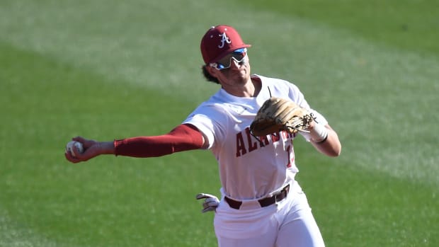 Alabama second baseman Bryce Eblin fields and throws to first to record an out as Alabama baseball opened the season with a series with Xavier Friday, Feb. 18, 2022, at Sewell-Thomas Stadium in Tuscaloosa.