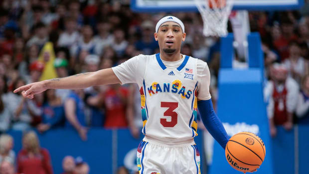 Feb 10, 2024; Lawrence, Kansas, USA; Kansas Jayhawks guard Dajuan Harris Jr. (3) sets the play during the second half against the Baylor Bears at Allen Fieldhouse. Mandatory Credit: William Purnell-USA TODAY Sports  