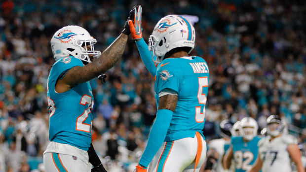Dolphins cornerback Xavien Howard and cornerback Jalen Ramsey celebrate after a play.