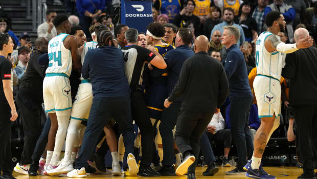 Members of the Golden State Warriors and Charlotte Hornets have to be separated at the end of a game.