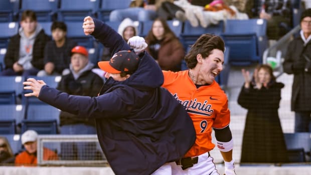 Henry Ford celebrates after hitting a home run during the Virginia baseball game against Hofstra at Disharoon Park.