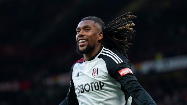 Alex Iwobi pictured celebrating after scoring a late winning goal for Fulham in a 2-1 victory at Manchester United in February 2024