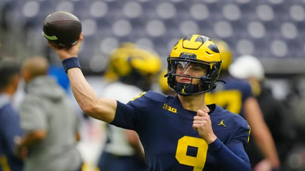 Jan 6, 2024; Houston, TX, USA; Michigan Wolverines quarterback J.J. McCarthy (9) passes the ball during a practice session before the College Football Playoff national championship game against the Washington Huskies at NRG Stadium. Mandatory Credit: Kirby Lee-USA TODAY Sports