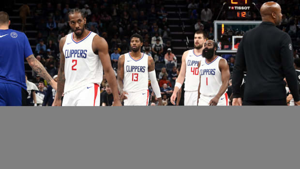 Feb 23, 2024; Memphis, Tennessee, USA; Los Angeles Clippers forward Kawhi Leonard (2), forward Paul George (13), center Ivica Zubac (40) and guard James Harden (1) walk to the bench during a time out during the second half against the Memphis Grizzlies at FedExForum. Mandatory Credit: Petre Thomas-USA TODAY Sports  