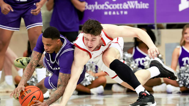 Feb 24, 2024; Fort Worth, Texas, USA; TCU Horned Frogs guard Avery Anderson III (3) and Cincinnati Bearcats guard Simas Lukosius (41) go for a loose ball during the second half at Ed and Rae Schollmaier Arena. Mandatory Credit: Kevin Jairaj-USA TODAY Sports