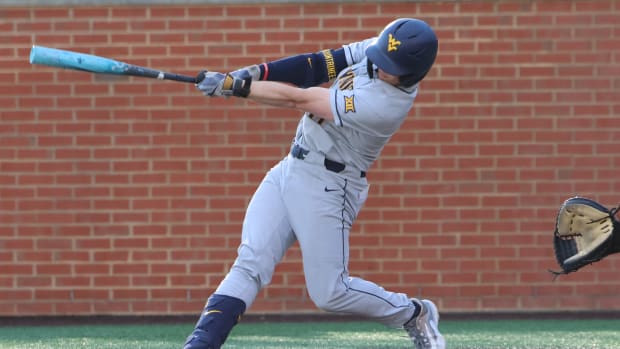 West Virginia sophomore Sam White lifts a two-run home run in the top of the first.