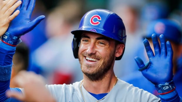 Sep 1, 2023; Cincinnati, Ohio, USA; Chicago Cubs first baseman Cody Bellinger (24) high fives teammates after hitting a solo home run in the third inning against the Cincinnati Reds at Great American Ball Park.