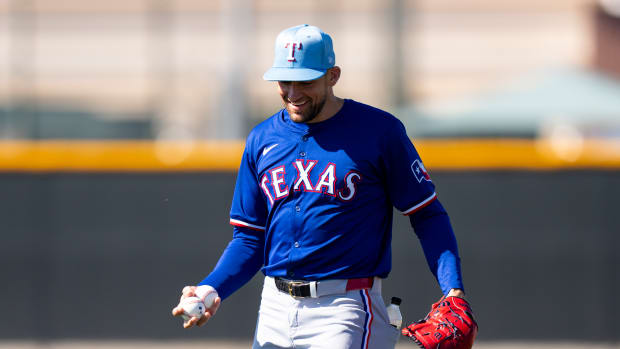 Nathan Eovaldi threw two scoreless innings in his first spring training appearance on Saturday in the Texas Rangers' 5-4 loss to the Kansas City Royals.