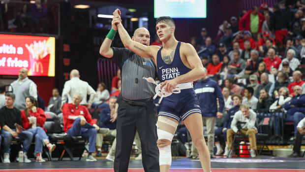 Penn State's Alex Facundo gets his hand raised after winning a 2023 bout against Rutgers in a Big Ten wrestling match.